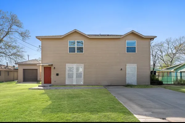 a view of a backyard of the house
