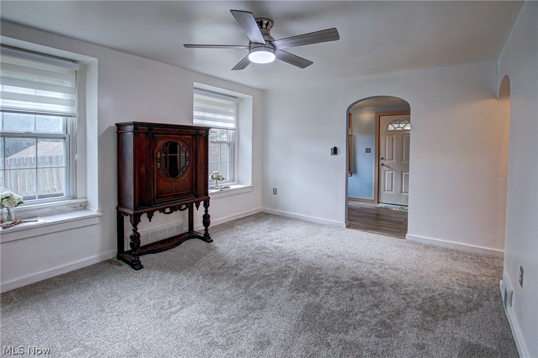688 Wooster Road North Barberton, OH 44203 - Photo 13 of 47 Living room featuring carpet flooring, plenty of natural light, and ceiling fan