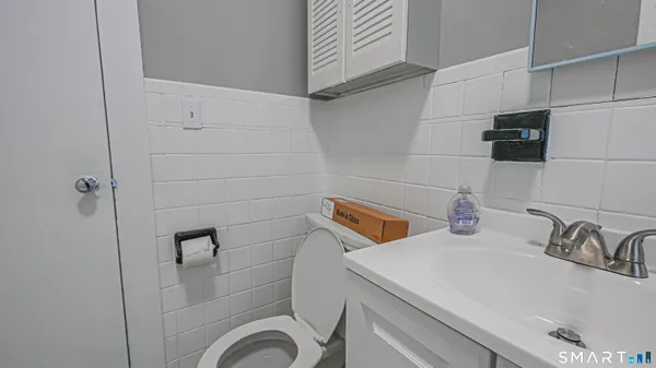 a utility room with sink dryer and washer