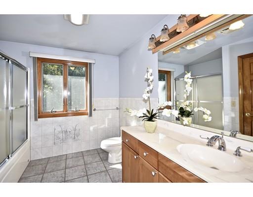 163 Gammons Road Acushnet, MA 02743 - Photo 16 of 22 a bathroom with a sink a toilet a mirror and window