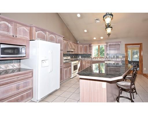 163 Gammons Road Acushnet, MA 02743 - Photo 7 of 22 a kitchen with kitchen island a counter top space appliances and cabinets