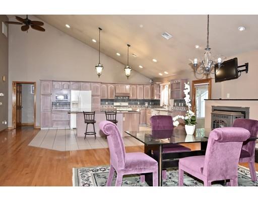 163 Gammons Road Acushnet, MA 02743 - Photo 8 of 22 a living room with furniture kitchen view and a wooden floor