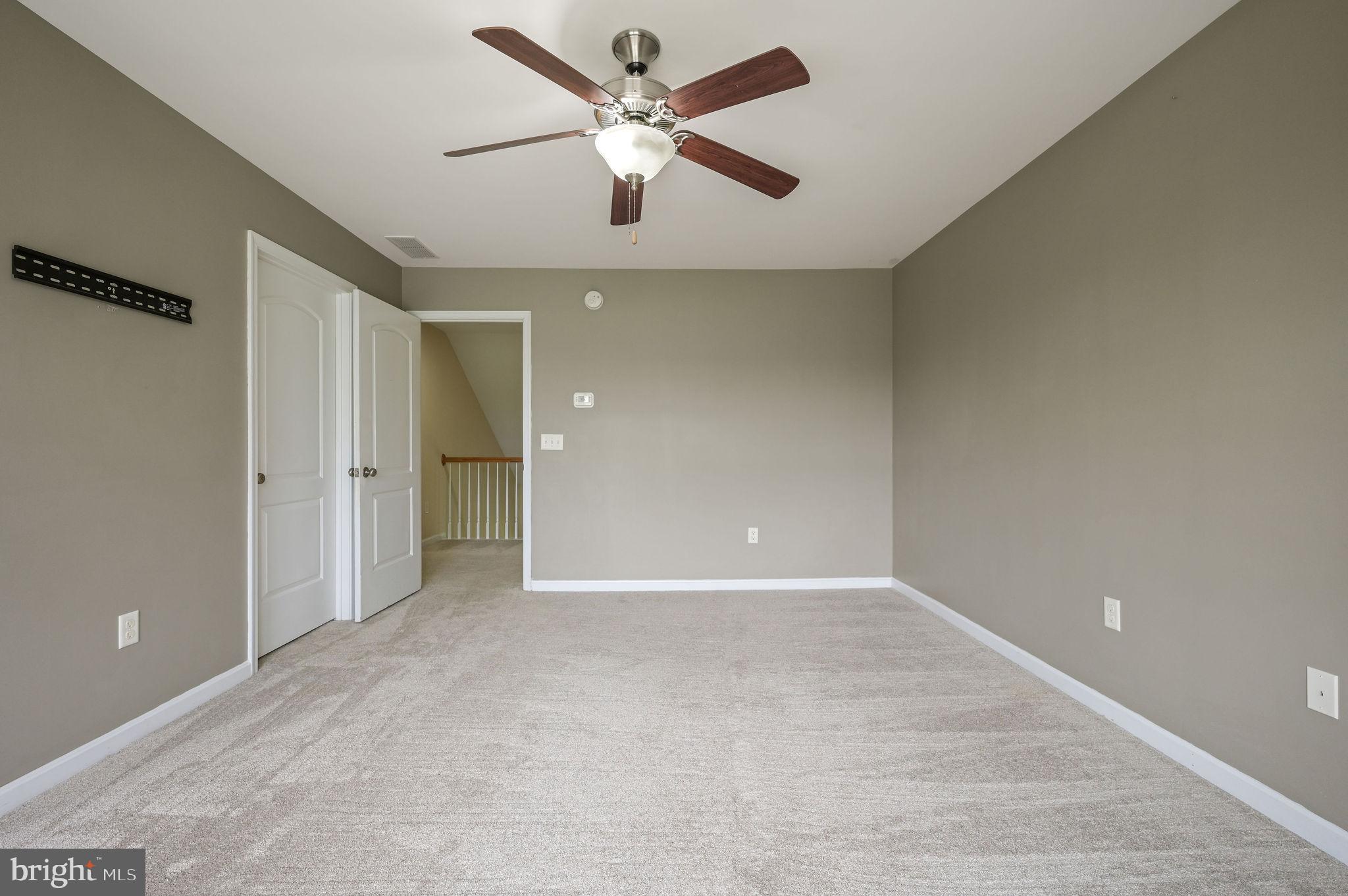 554 Phillips Drive Magnolia, DE 19962 - Photo 21 of 31 an empty room with fan and a ceiling fan
