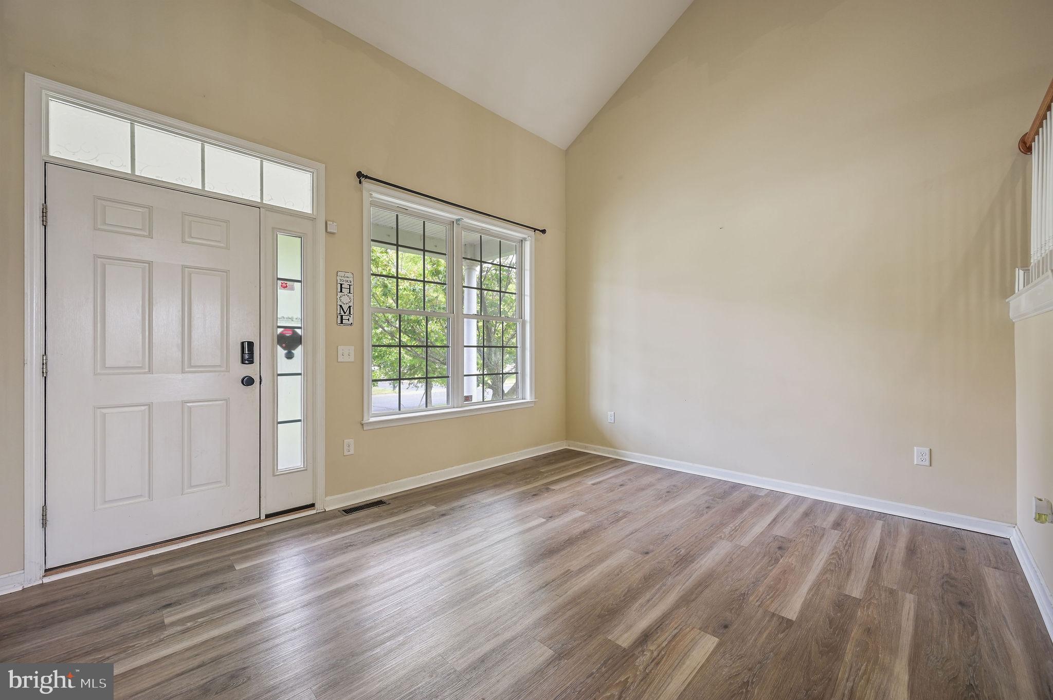 554 Phillips Drive Magnolia, DE 19962 - Photo 8 of 31 a view of an empty room with wooden floor and a window