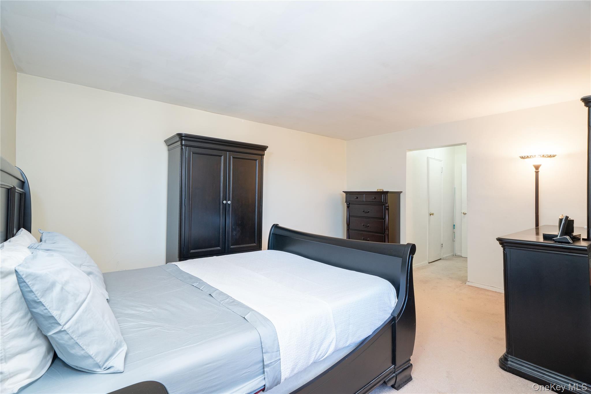 495 Odell Avenue, Unit 8R Yonkers, NY 10703 - Photo 14 of 27 Bedroom with light colored carpet