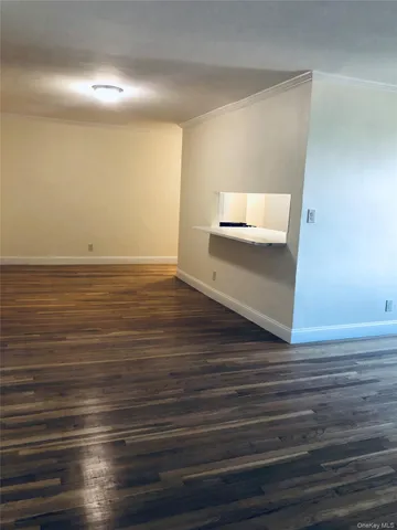 a view of room and wooden floor