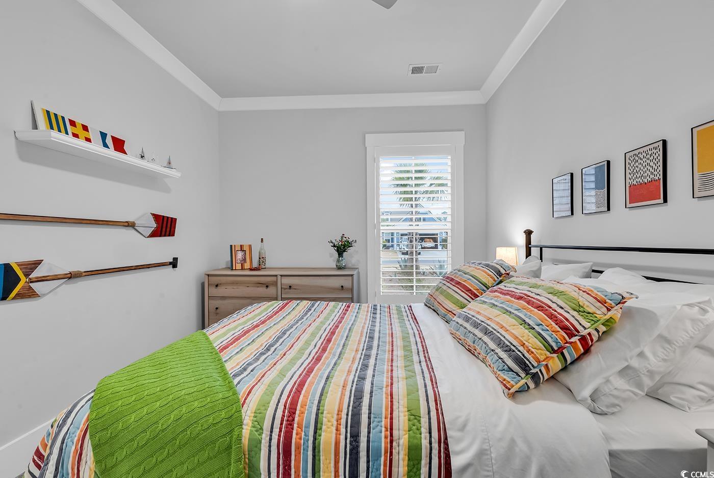6013 Tramonto Street Myrtle Beach, SC 29577 - Photo 12 of 40 Bedroom featuring crown molding and ceiling fan