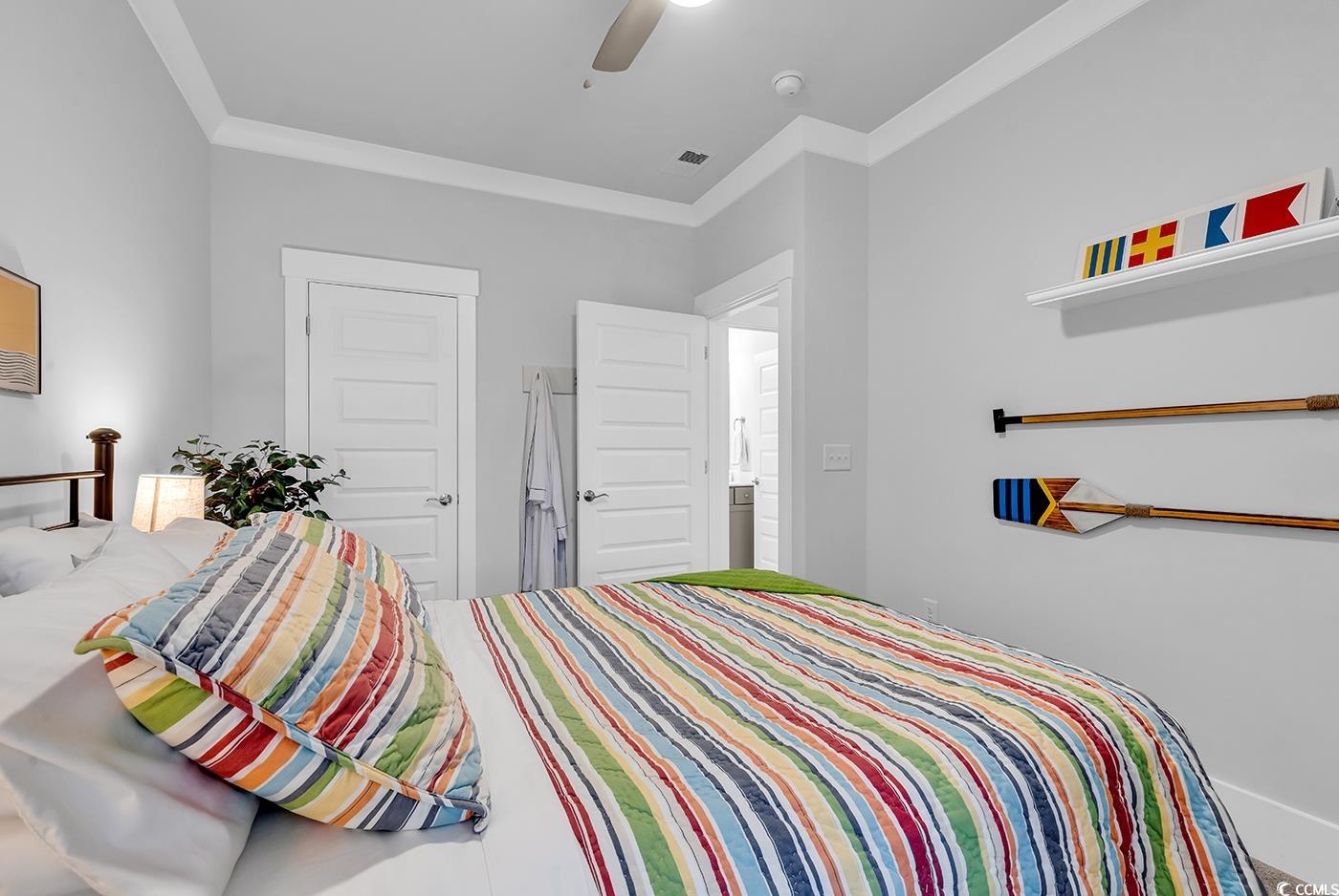 6013 Tramonto Street Myrtle Beach, SC 29577 - Photo 13 of 40 Bedroom with crown molding and a ceiling fan
