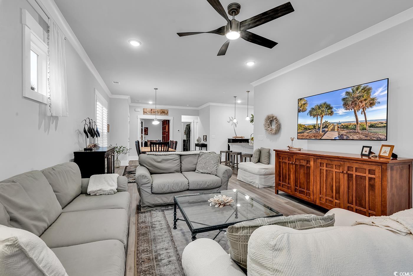 6013 Tramonto Street Myrtle Beach, SC 29577 - Photo 28 of 40 Living room featuring ornamental molding, wood finished floors, recessed lighting, and ceiling fan