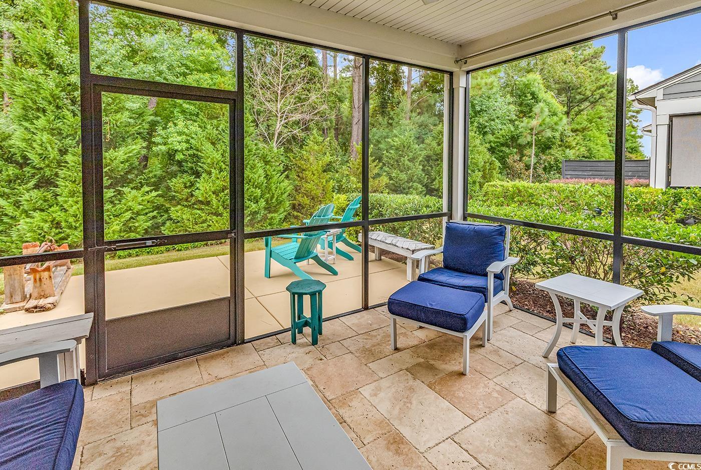 6013 Tramonto Street Myrtle Beach, SC 29577 - Photo 30 of 40 Sunroom / solarium with view of scattered trees