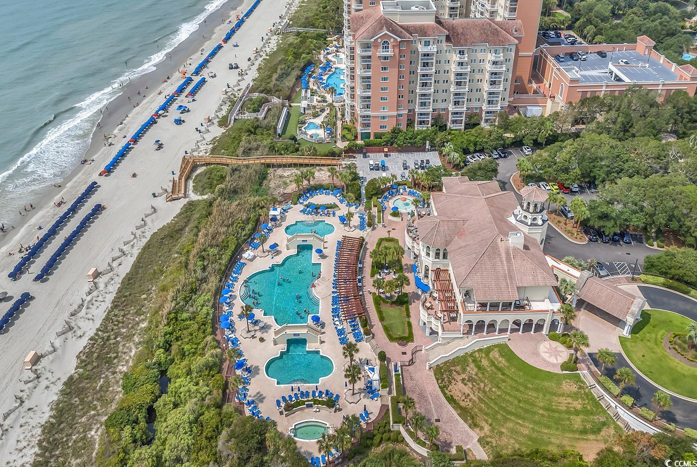 6013 Tramonto Street Myrtle Beach, SC 29577 - Photo 40 of 40 Aerial view of a pool area and extended coastline