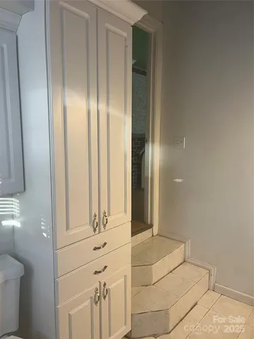 a view of a bathroom with mirror