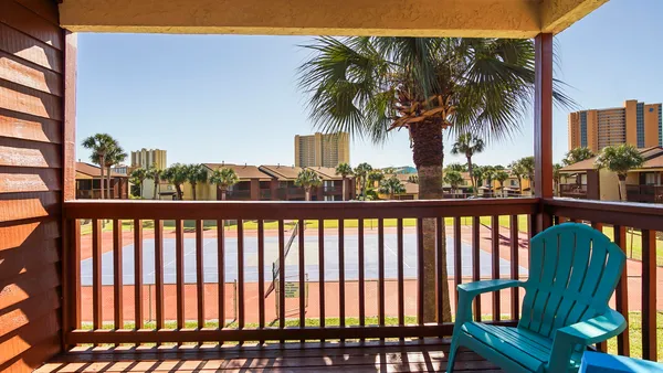 a view of a balcony with a potted plant