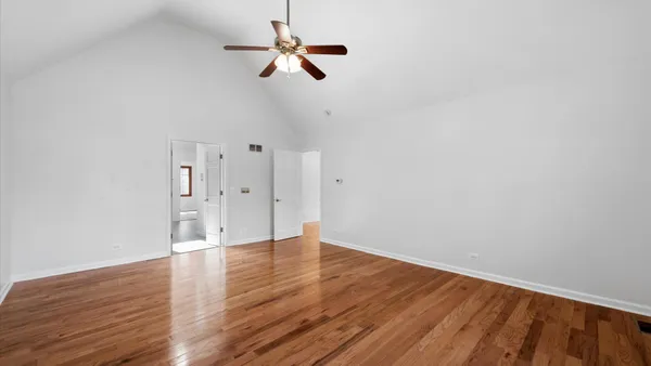 a kitchen with a stove and a white cabinets