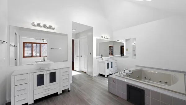 a bathroom with a sink and mirror