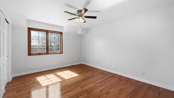 a bathroom with a toilet a sink and a mirror