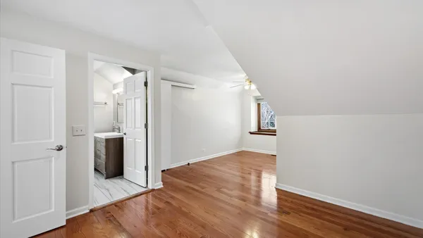 a kitchen with stainless steel appliances kitchen island granite countertop a refrigerator and a sink