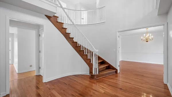 a view of entryway with wooden floor