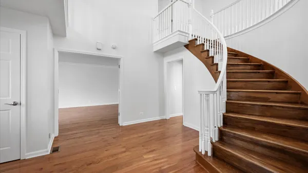 a view of entryway with wooden floor