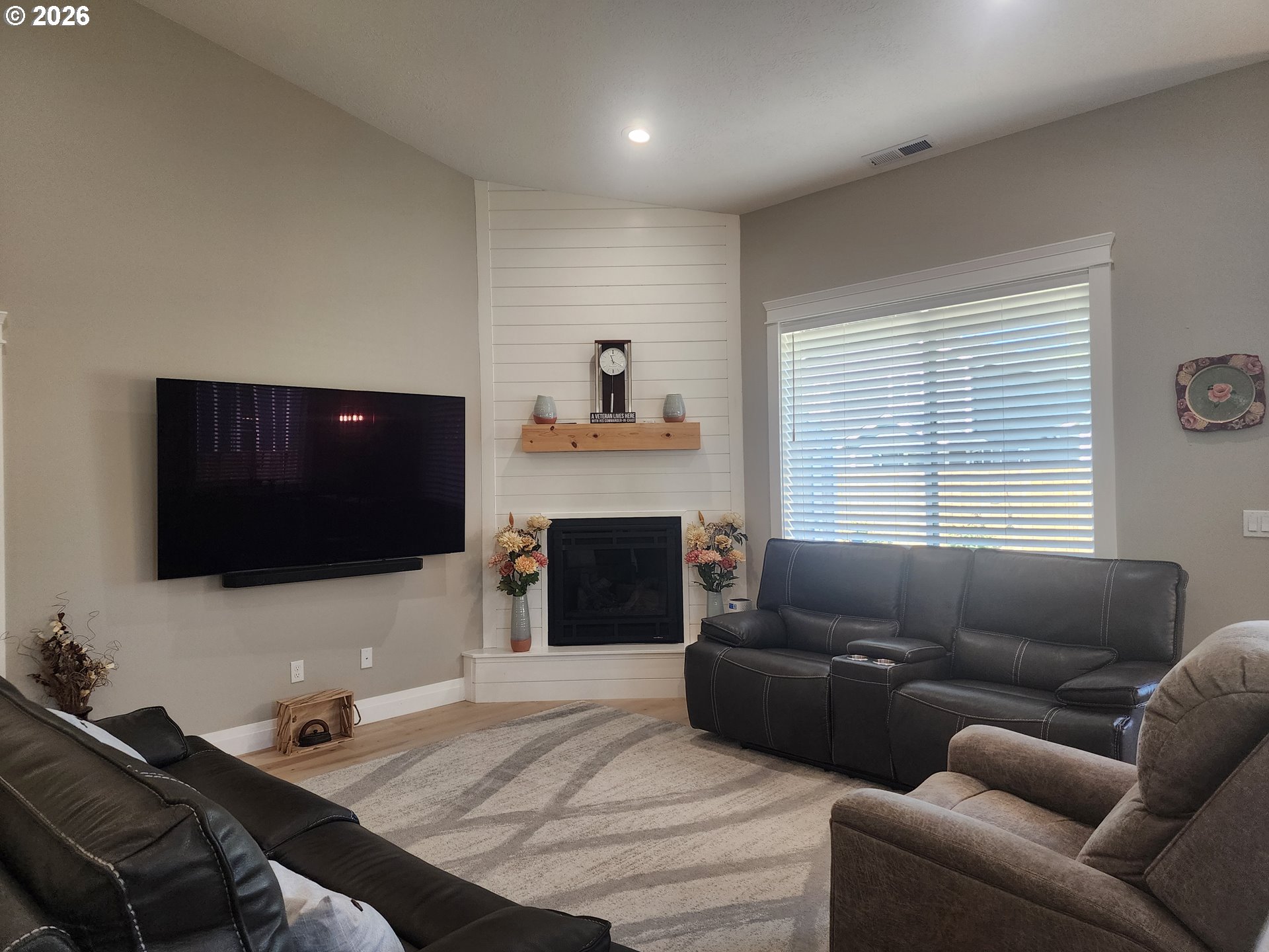 845 1st Street Gervais, OR 97026 - Photo 11 of 29 a living room with furniture and a flat screen tv