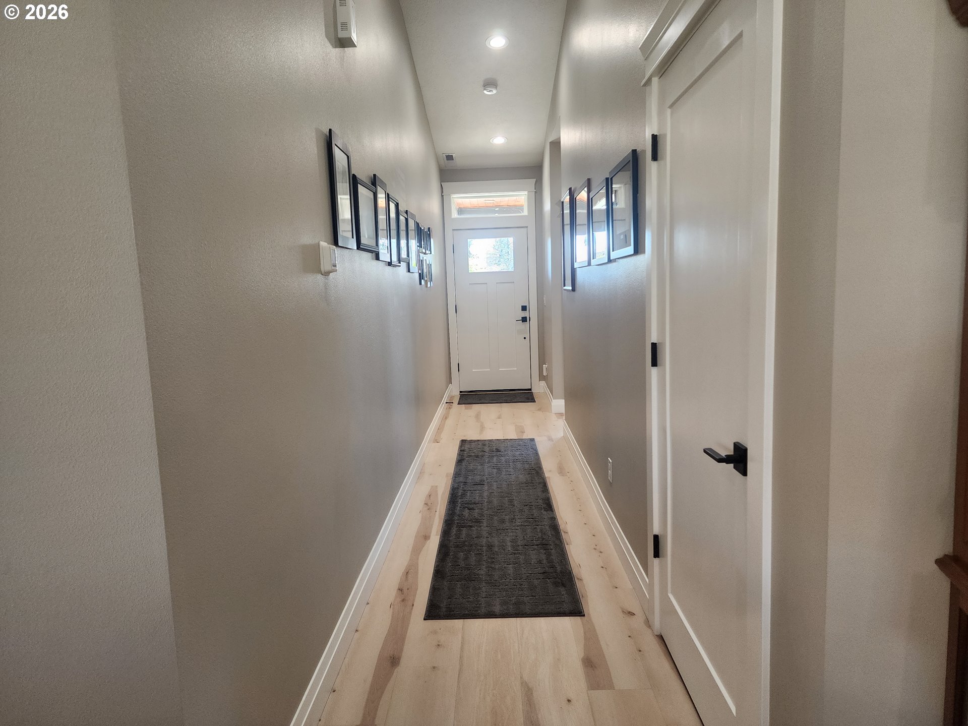 845 1st Street Gervais, OR 97026 - Photo 18 of 29 a view of a hallway with wooden floor and staircase