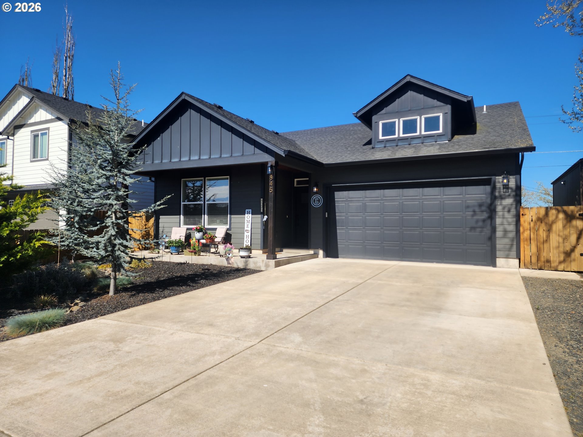 845 1st Street Gervais, OR 97026 - Photo 2 of 29 a front view of a house with a yard and garage