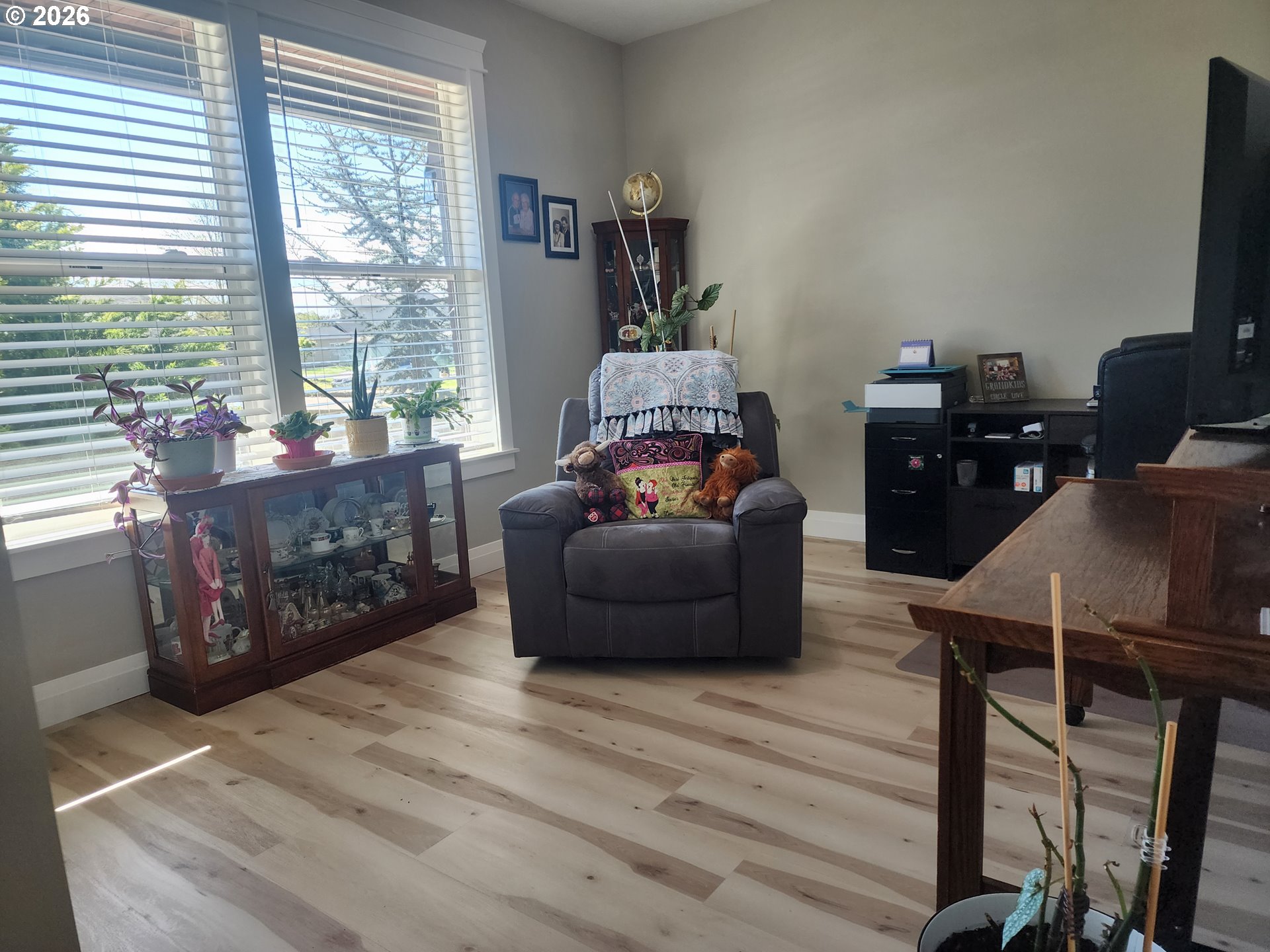 845 1st Street Gervais, OR 97026 - Photo 21 of 29 a living room with furniture and a flat screen tv