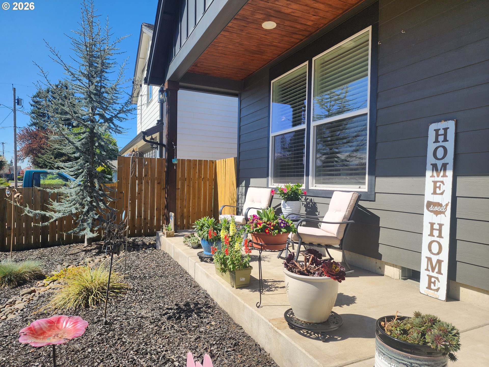 845 1st Street Gervais, OR 97026 - Photo 3 of 29 a view of a patio with chairs and potted plants