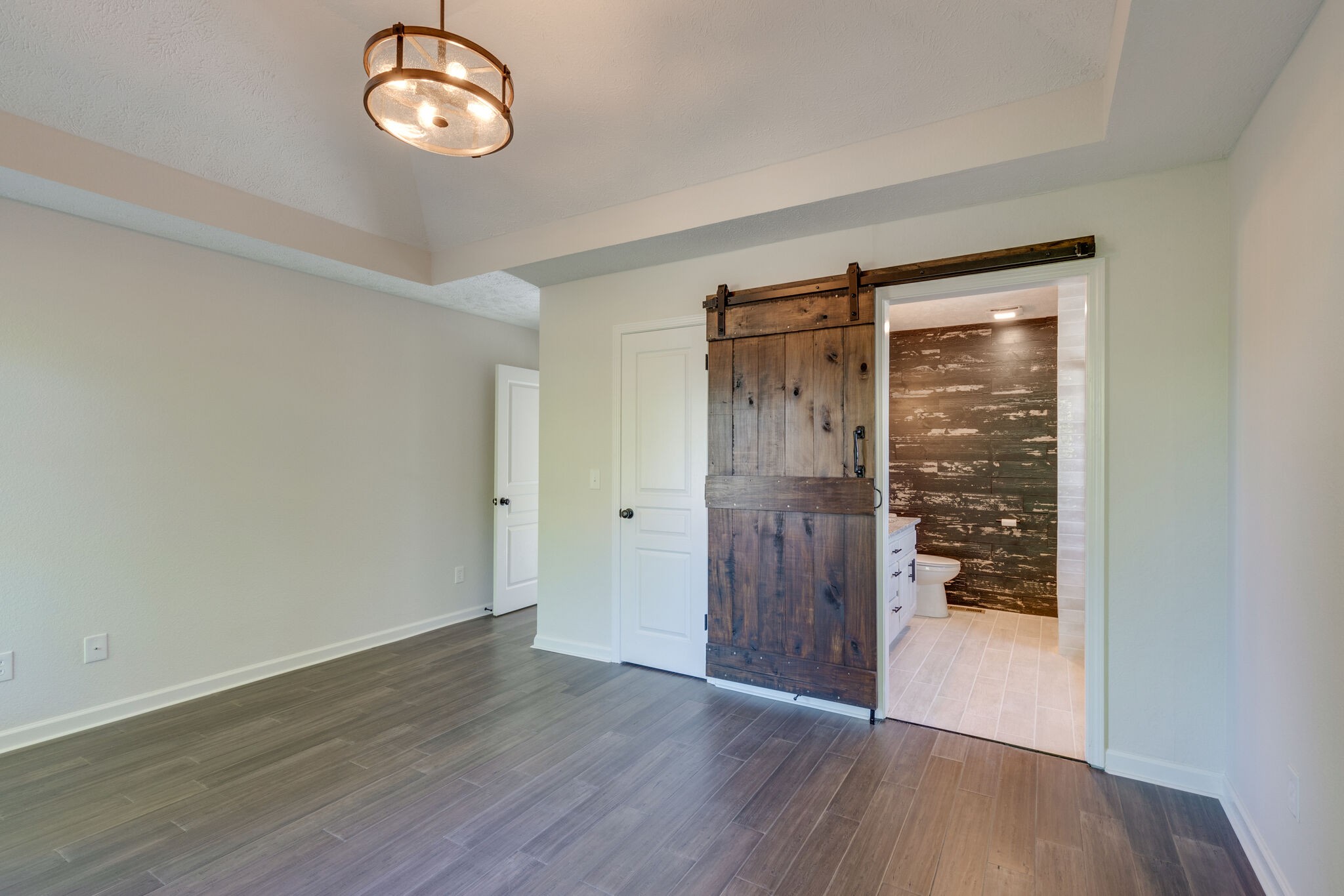3648 Mahlon Moore Road Spring Hill, TN 37174 - Photo 17 of 30 an empty room with wooden floor and windows