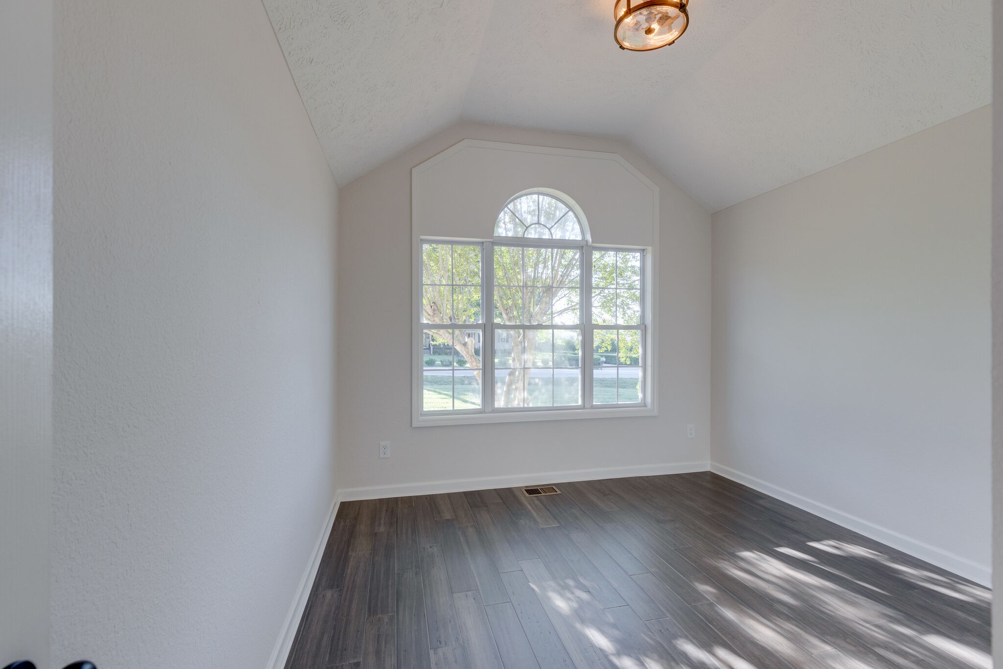 3648 Mahlon Moore Road Spring Hill, TN 37174 - Photo 21 of 30 an empty room with wooden floor and windows