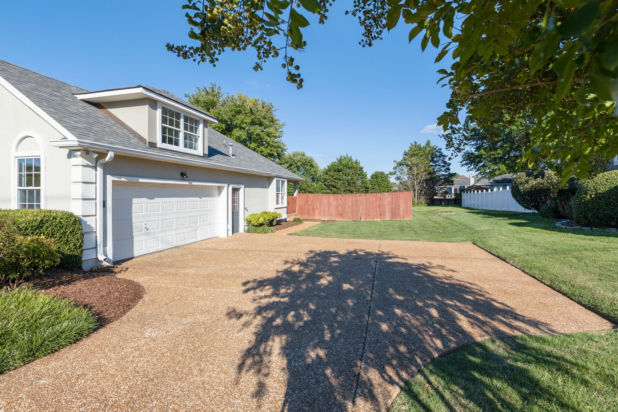 3648 Mahlon Moore Road Spring Hill, TN 37174 - Photo 26 of 30 a front view of a house with a yard and garage