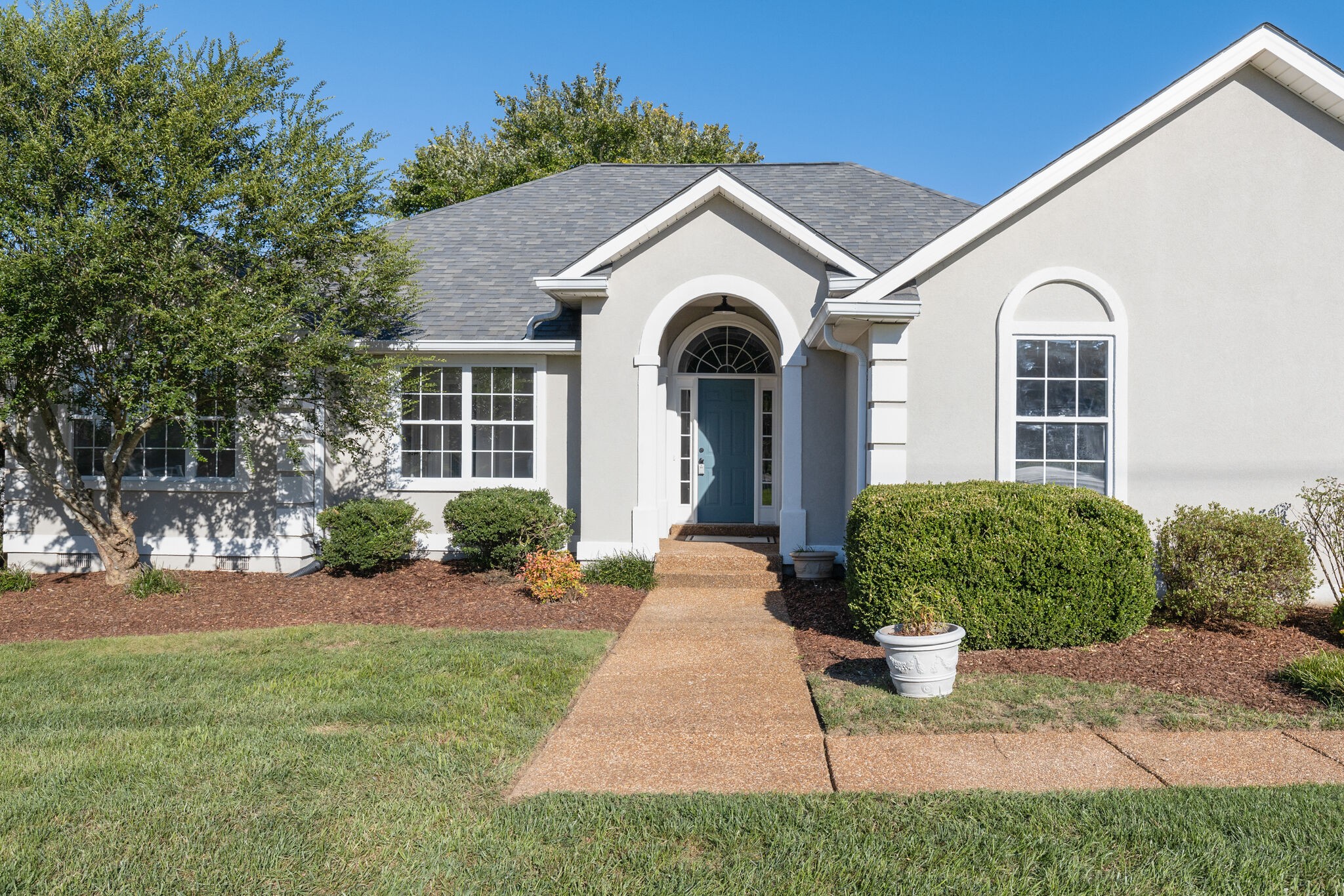 3648 Mahlon Moore Road Spring Hill, TN 37174 - Photo 3 of 30 a view of a white house with a yard and plants