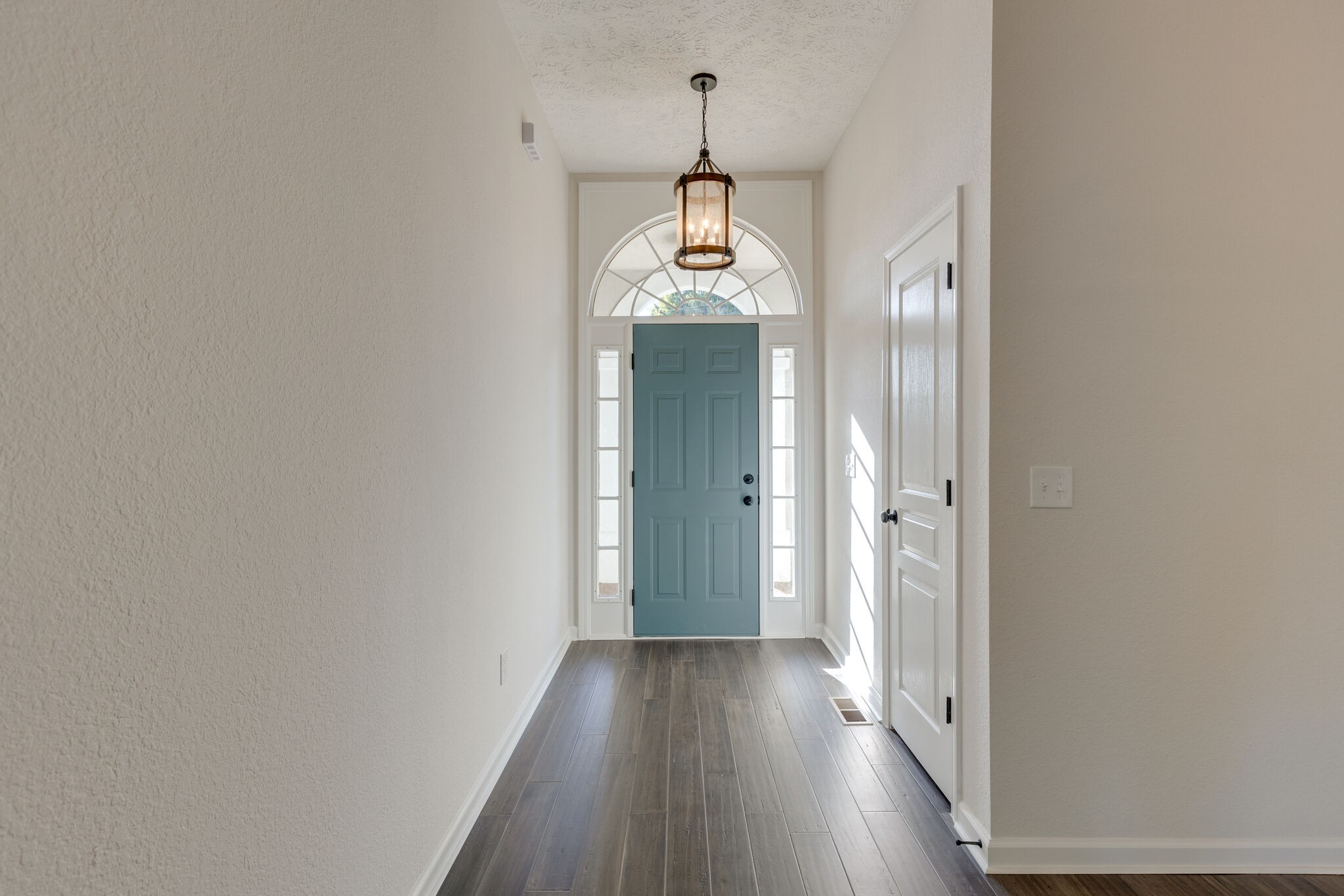3648 Mahlon Moore Road Spring Hill, TN 37174 - Photo 5 of 30 a view of a hallway with wooden floor and staircase