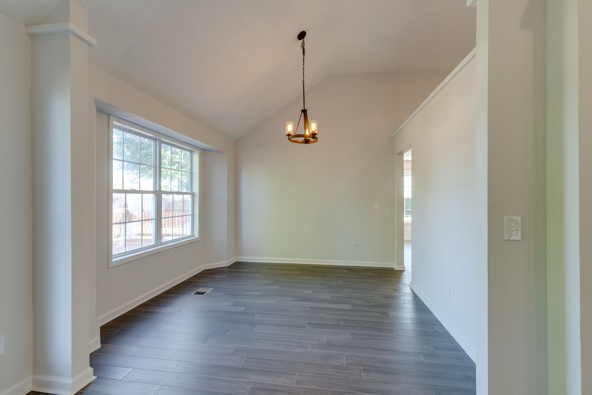 3648 Mahlon Moore Road Spring Hill, TN 37174 - Photo 10 of 30 a view of a room with wooden floor windows and cabinet