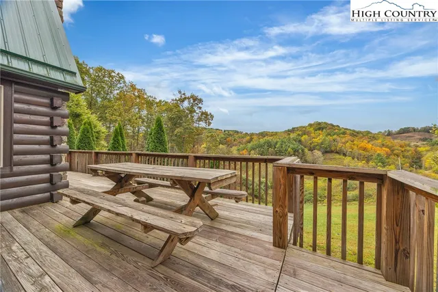 a view of a balcony with wooden chairs with wooden floor