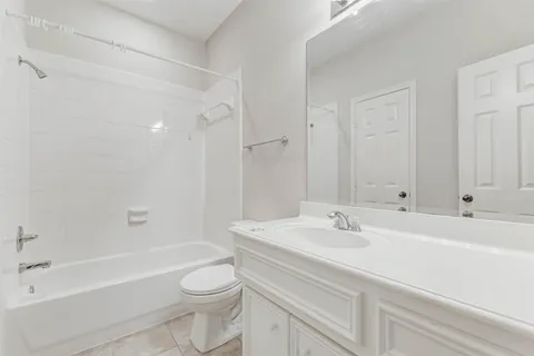 a bathroom with a sink a toilet and a bathtub
