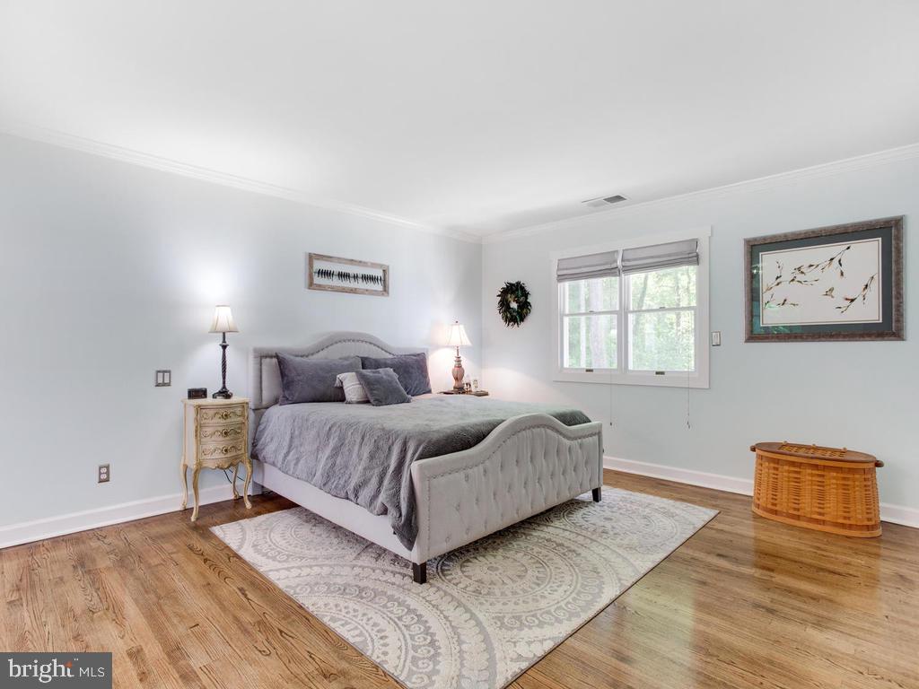 6678 Old Solomons Island Road Friendship, MD 20758 - Photo 28 of 57 a living room with a bed furniture and a window