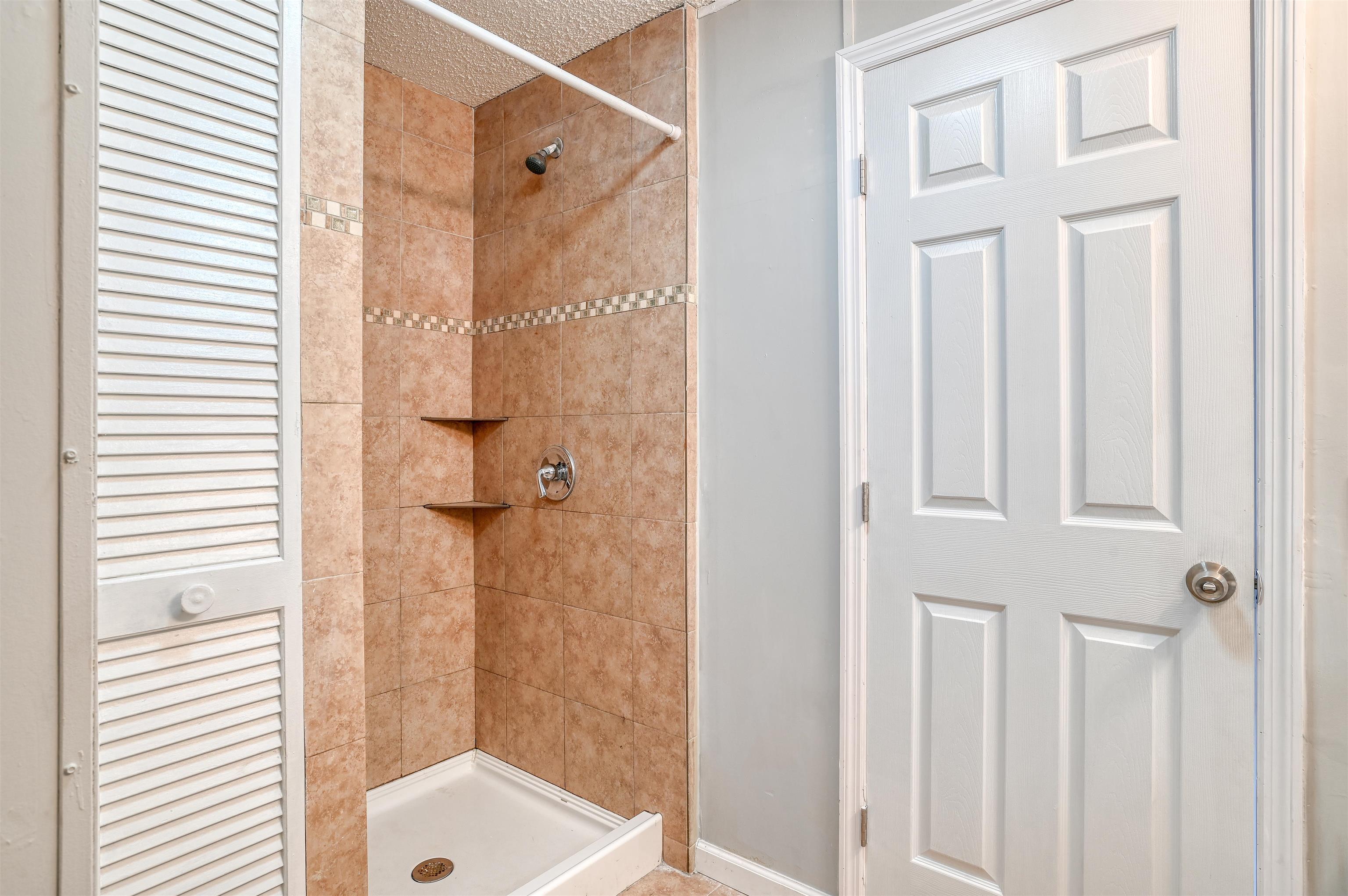4661 Second Avenue St. Augustine, FL 32095 - Photo 16 of 26 a bathroom with a shower