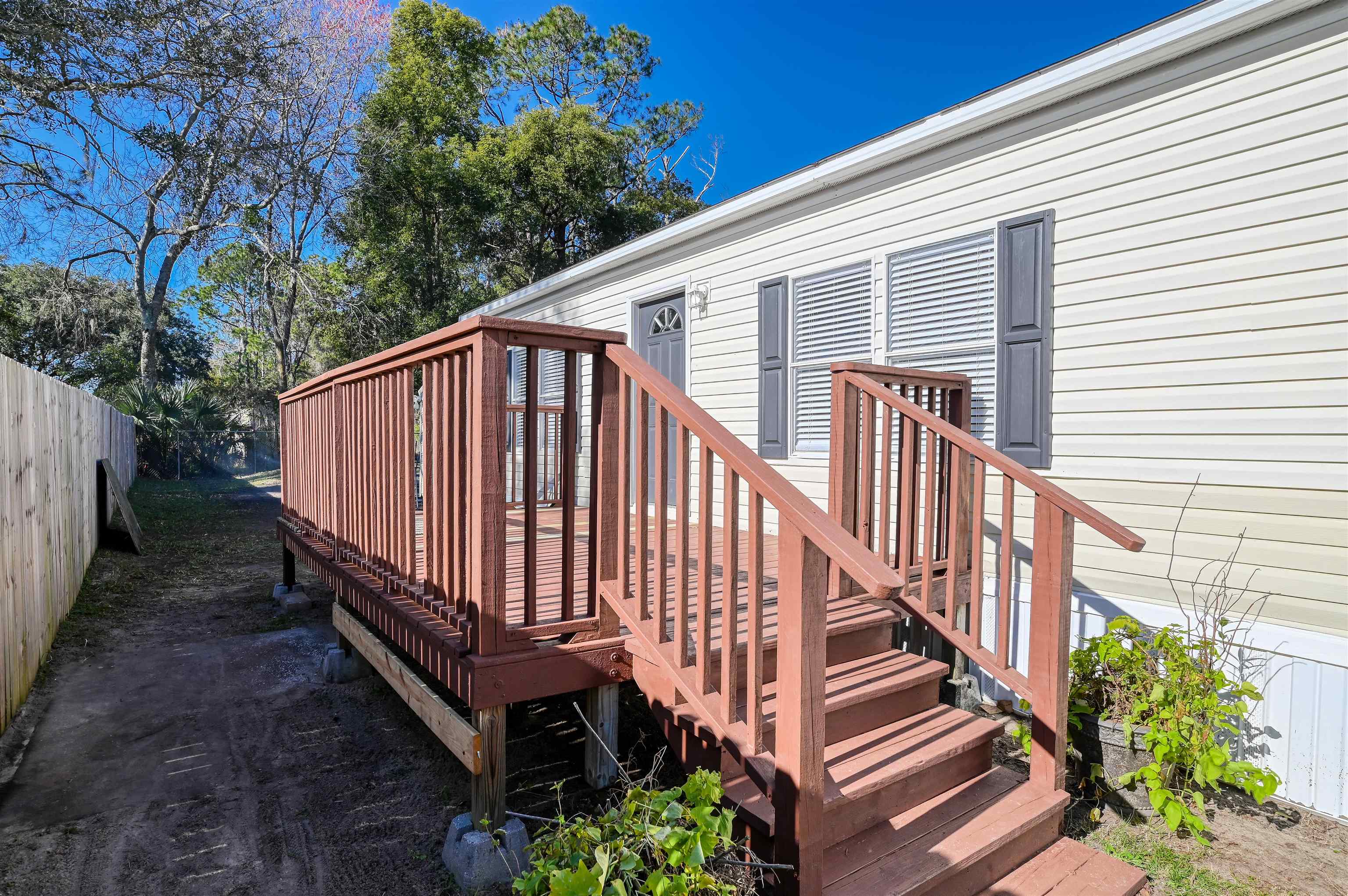 4661 Second Avenue St. Augustine, FL 32095 - Photo 2 of 26 a view of a house with backyard and wooden deck