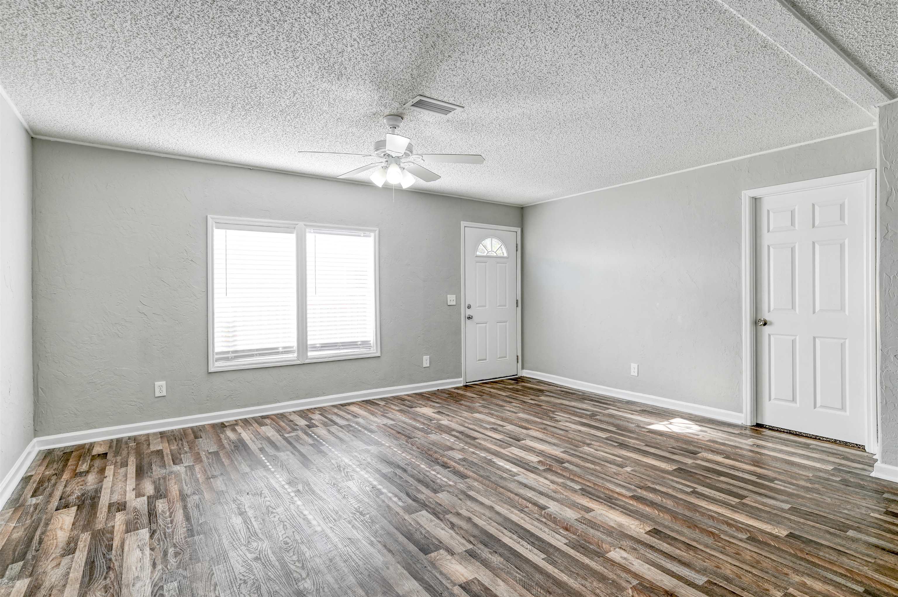 4661 Second Avenue St. Augustine, FL 32095 - Photo 7 of 26 wooden floor in an empty room with a window