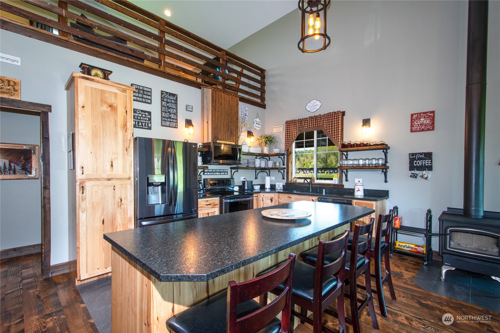 9333 Willow Grove Road Longview, WA 98632 - Photo 10 of 40 a dining room with stainless steel appliances a dining table chairs and couches