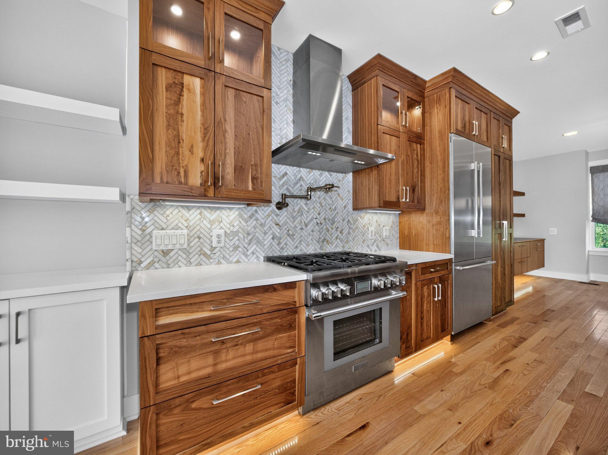 17217 Redland Road Rockville, MD 20855 - Photo 17 of 44 Beaming cabinets, range, and pot filler at hand!