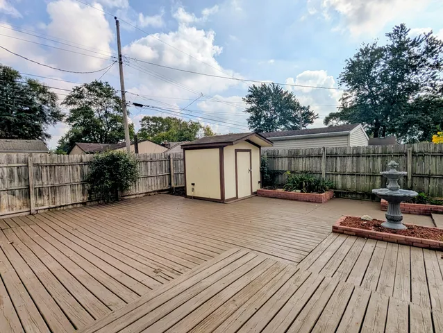 a view of a wooden deck with a patio