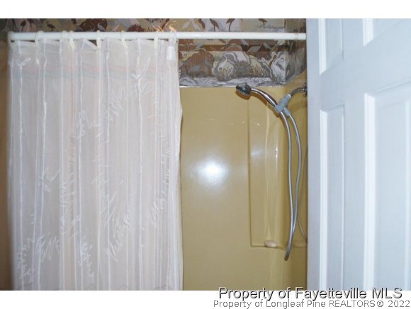 7371 Sherrill Baggett Road Dunn, NC 28334 - Photo 16 of 25 a view of a bathroom with a shower