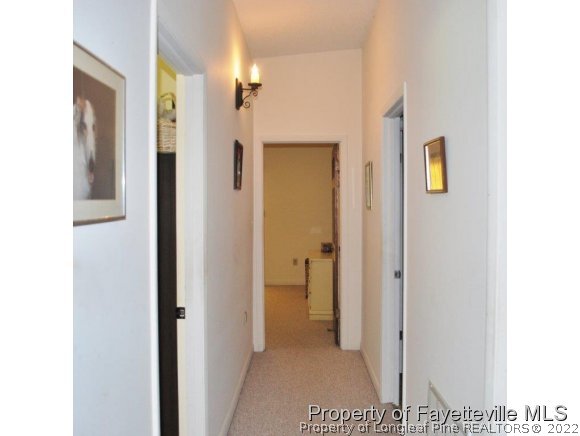 7371 Sherrill Baggett Road Dunn, NC 28334 - Photo 21 of 25 a view of a bathroom from a hallway