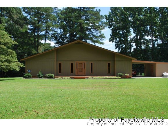 7371 Sherrill Baggett Road Dunn, NC 28334 - Photo 25 of 25 a house that has a big yard