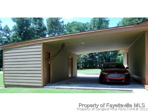 7371 Sherrill Baggett Road Dunn, NC 28334 - Photo 4 of 25 a view of a car parked in back of a house