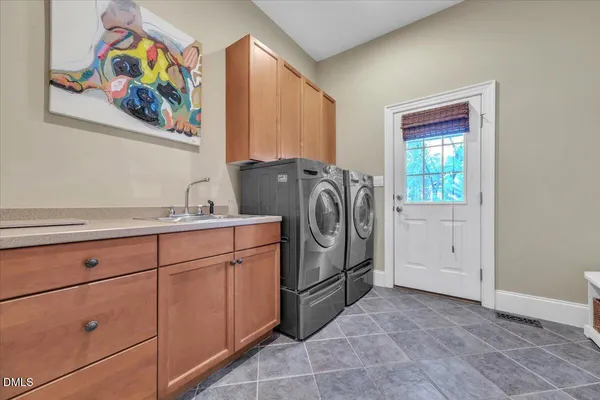 a bathroom with double sink and a mirror