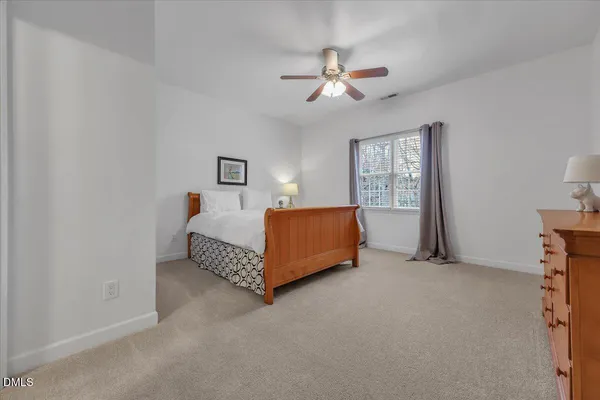 a living room with furniture a piano and a flat screen tv