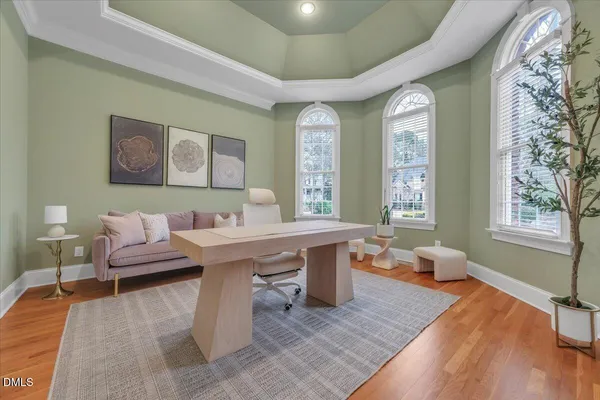 a view of a dining room with furniture and wooden floor